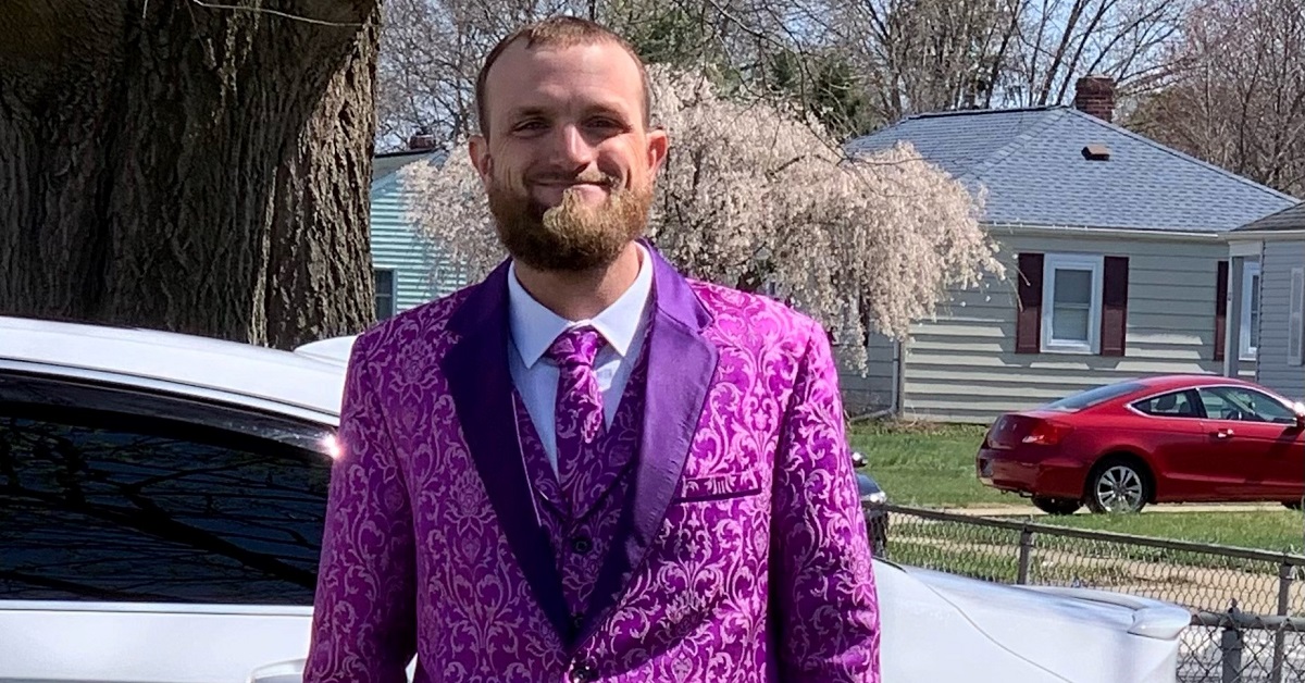 josh day in purple suit outside of home