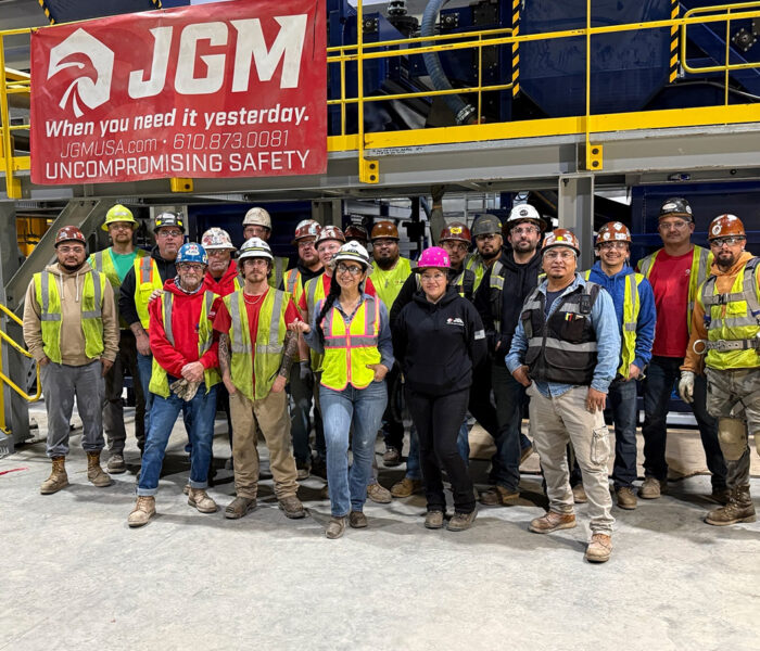 Large group of JGM team on a job site