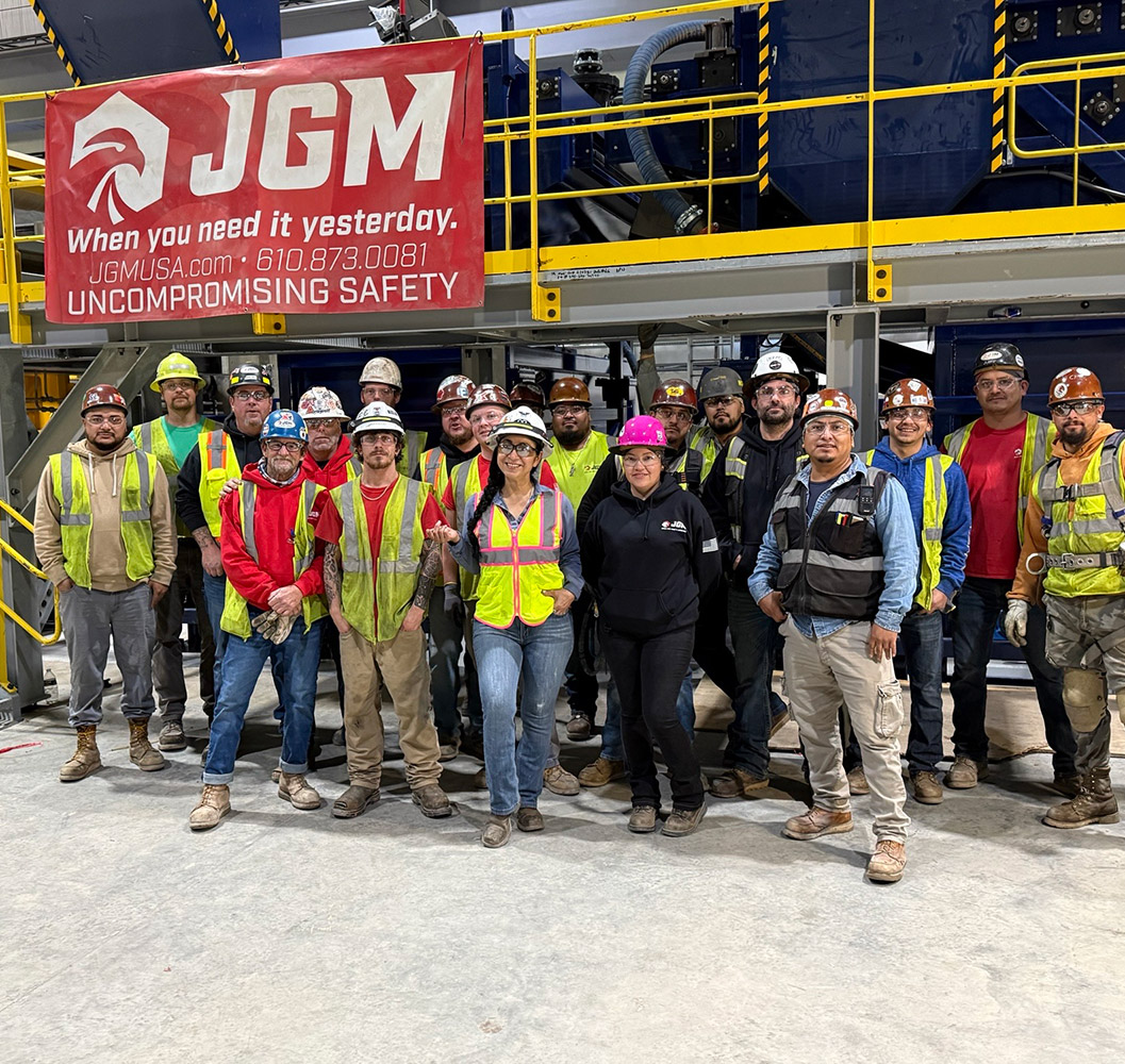 Large group of JGM team on a job site